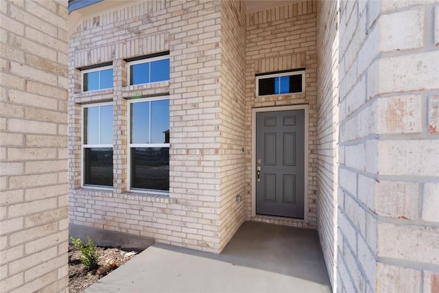 2705 Sage Ranch Dr Unit 6, Leander, TX 78641 - view of exterior entry featuring brick siding