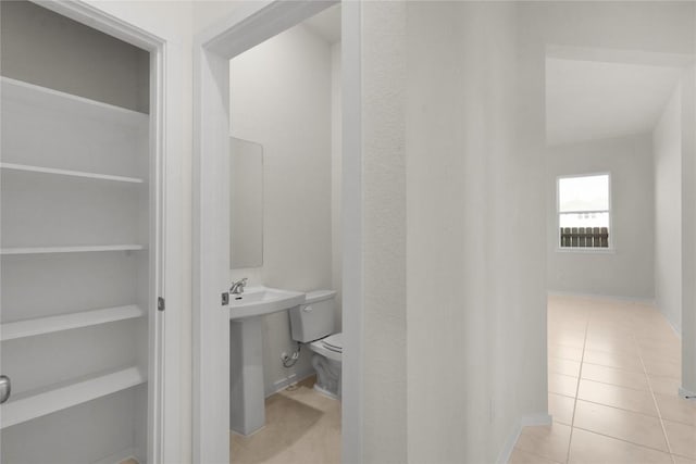 2705 Sage Ranch Dr Unit 6, Leander, TX 78641 - half bath with tile patterned flooring, toilet, and baseboards