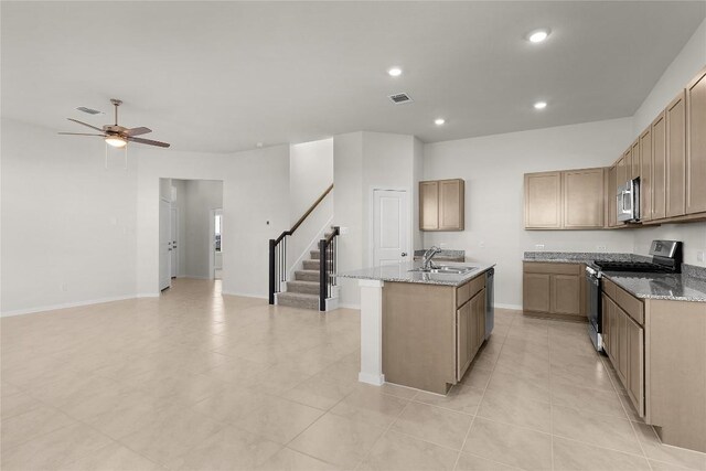 2705 Sage Ranch Dr Unit 6, Leander, TX 78641 - kitchen with stainless steel appliances, ceiling fan, an island with sink, light stone counters, and recessed lighting