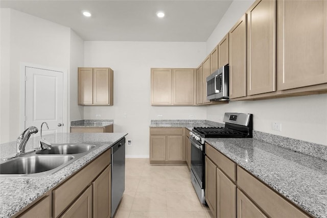 2705 Sage Ranch Dr Unit 6, Leander, TX 78641 - kitchen featuring stainless steel appliances, a sink, baseboards, recessed lighting, and light stone counters
