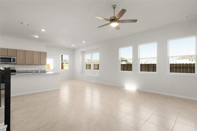 2705 Sage Ranch Dr Unit 6, Leander, TX 78641 - unfurnished living room with a ceiling fan, recessed lighting, baseboards, a sink, and light tile patterned floors