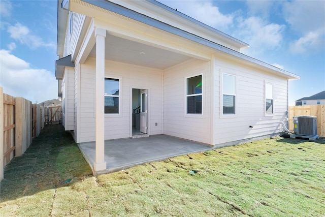 2705 Sage Ranch Dr Unit 6, Leander, TX 78641 - back of house with central AC and a patio