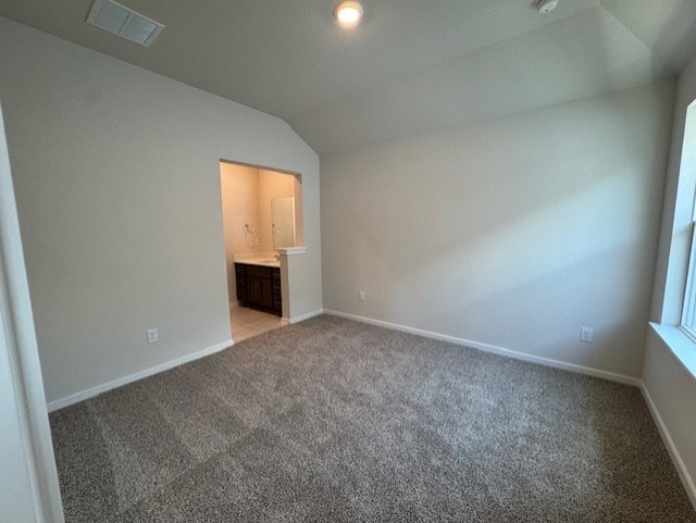 2705 Sage Ranch Dr Unit 6, Leander, TX 78641 - unfurnished bedroom featuring lofted ceiling, light carpet, and ensuite bathroom
