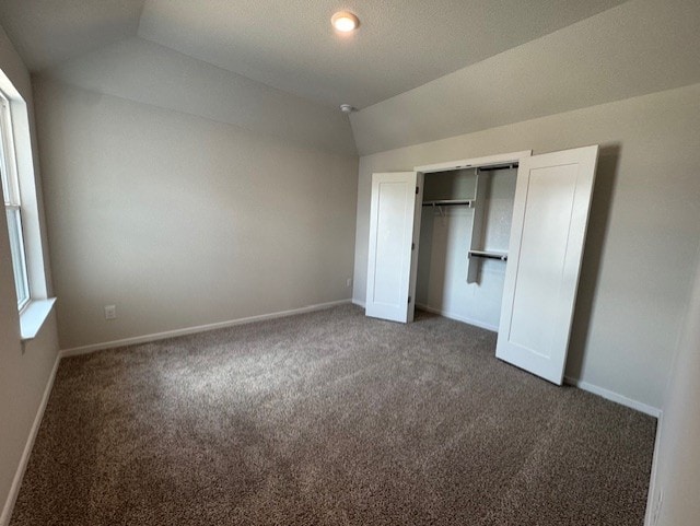 2705 Sage Ranch Dr Unit 6, Leander, TX 78641 - unfurnished bedroom featuring vaulted ceiling, carpet, and a closet