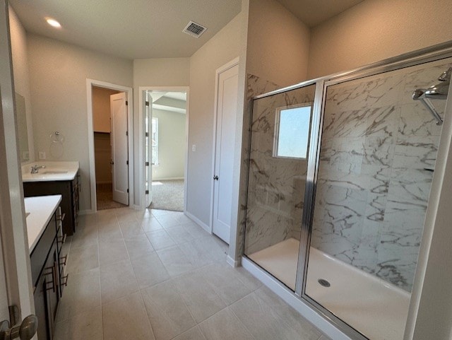 2705 Sage Ranch Dr Unit 6, Leander, TX 78641 - bathroom featuring a marble finish shower and vanity