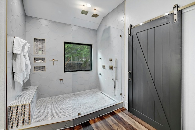 full bathroom featuring walk in shower and wood finished floors