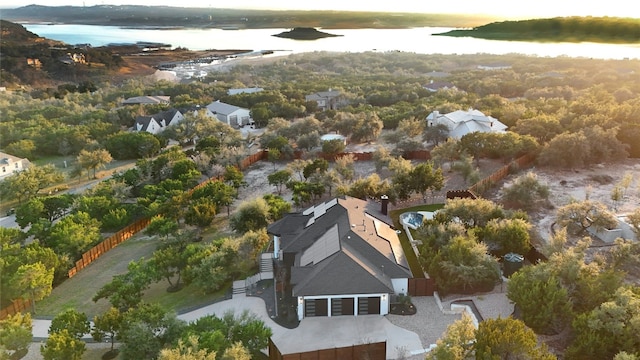 birds eye view of property featuring a water view