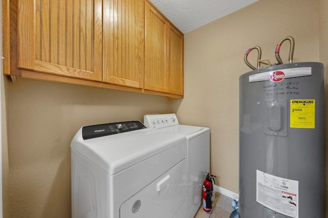 1206 Hi Stirrup Unit 311, Horseshoe Bay, TX 78657 - washroom featuring electric water heater, cabinet space, washing machine and dryer, tile patterned flooring, and a textured ceiling