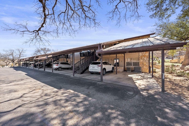 1206 Hi Stirrup Unit 311, Horseshoe Bay, TX 78657 - covered parking lot featuring stairway