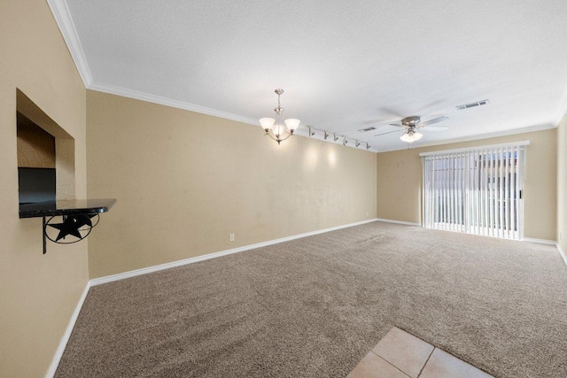 1206 Hi Stirrup Unit 311, Horseshoe Bay, TX 78657 - unfurnished living room featuring crown molding, a chandelier, carpet floors, and a ceiling fan