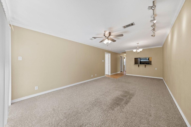 1206 Hi Stirrup Unit 311, Horseshoe Bay, TX 78657 - spare room with carpet flooring, rail lighting, ceiling fan, a chandelier, and crown molding