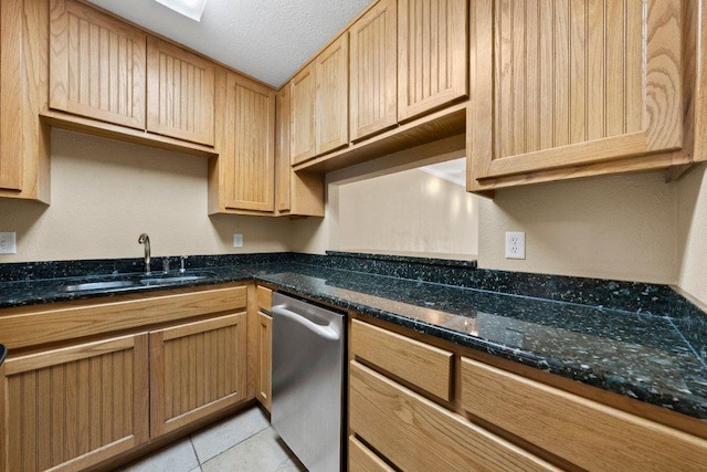 1206 Hi Stirrup Unit 311, Horseshoe Bay, TX 78657 - kitchen featuring dishwasher, a textured ceiling, dark stone counters, and light tile patterned floors