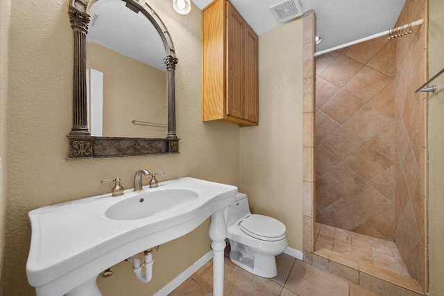 1206 Hi Stirrup Unit 311, Horseshoe Bay, TX 78657 - bathroom featuring a tile shower and tile patterned flooring