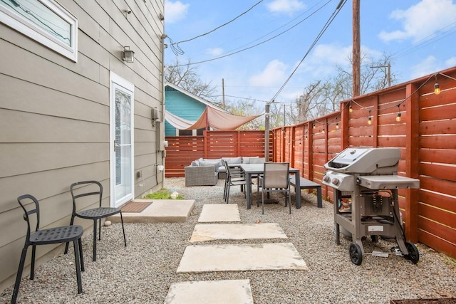 1201 Taylor St, Austin, TX 78702 - fenced backyard with outdoor lounge area, outdoor dining area, a patio area, and a grill