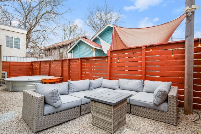 1201 Taylor St, Austin, TX 78702 - fenced backyard featuring an outdoor hangout area, a hot tub, and a patio area