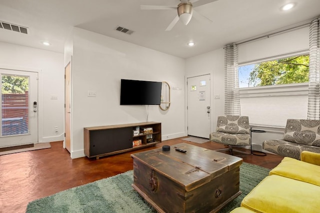 1201 Taylor St, Austin, TX 78702 - living room with a ceiling fan, healthy amount of natural light, recessed lighting, concrete flooring, and baseboards