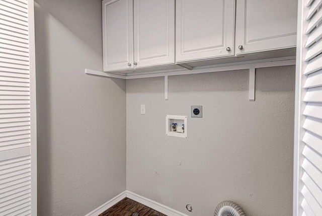 washroom featuring cabinet space, baseboards, hookup for a gas dryer, washer hookup, and electric dryer hookup