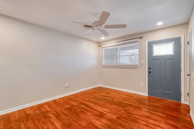 foyer entrance with ceiling fan, baseboards, wood finished floors, and recessed lighting