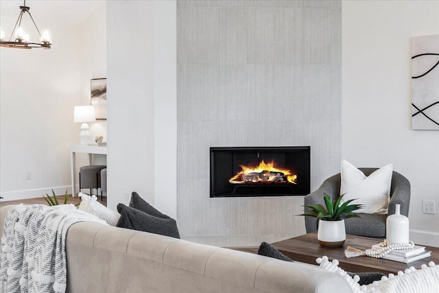 15400 Fm 1826, Austin, TX 78737 - living area featuring a fireplace and a chandelier