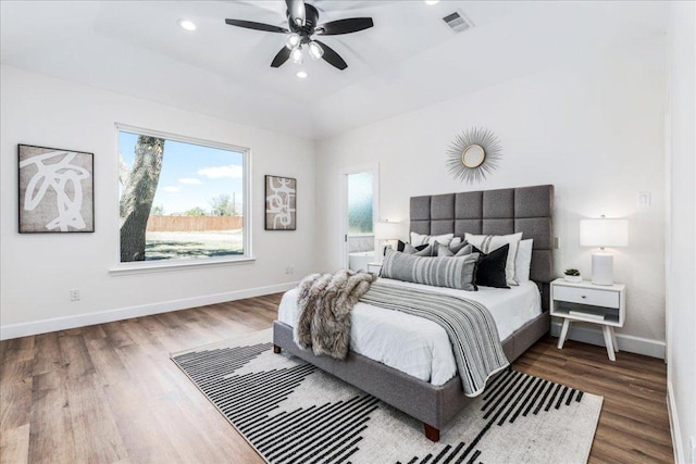 15400 Fm 1826, Austin, TX 78737 - bedroom featuring wood finished floors, ceiling fan, recessed lighting, and connected bathroom