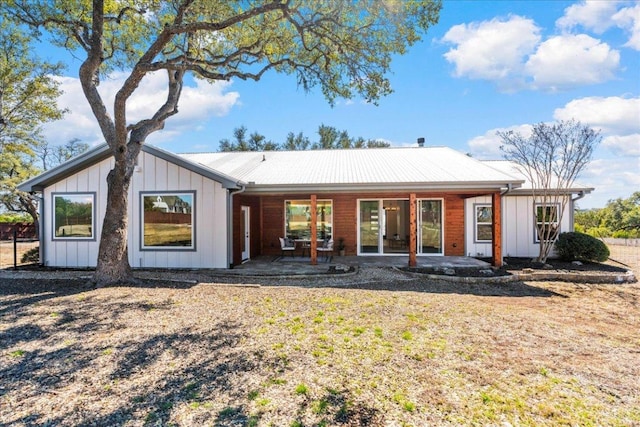 15400 Fm 1826, Austin, TX 78737 - back of property featuring a patio and board and batten siding