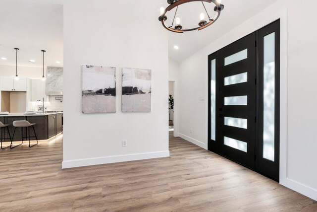 15400 Fm 1826, Austin, TX 78737 - foyer with a chandelier, light wood-style flooring, recessed lighting, and lofted ceiling