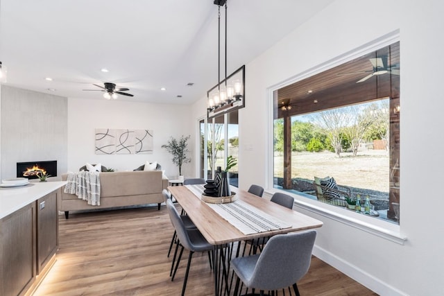 15400 Fm 1826, Austin, TX 78737 - dining space with ceiling fan, light wood finished floors, recessed lighting, and a large fireplace