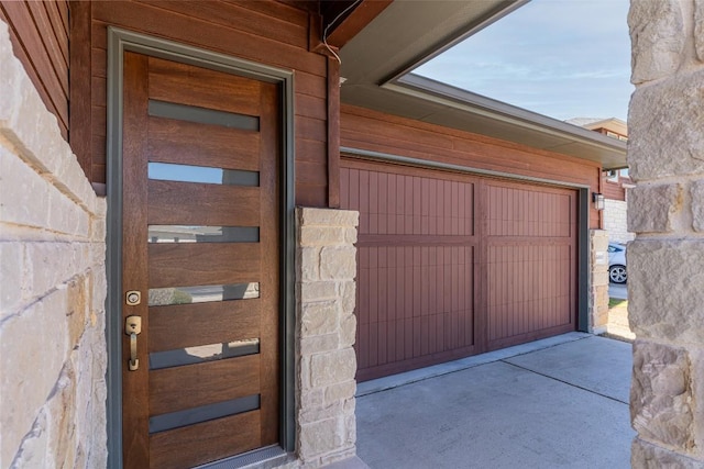 property entrance featuring a garage