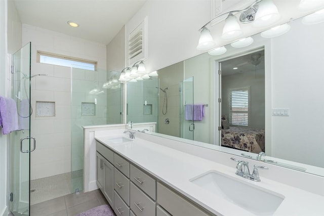 ensuite bathroom with plenty of natural light, connected bathroom, and a sink