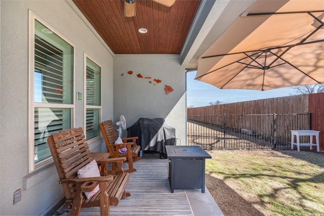 view of patio featuring fence and grilling area