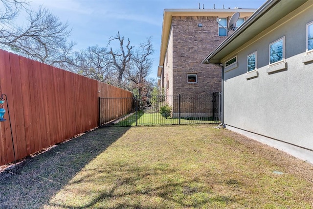 view of yard with a fenced backyard