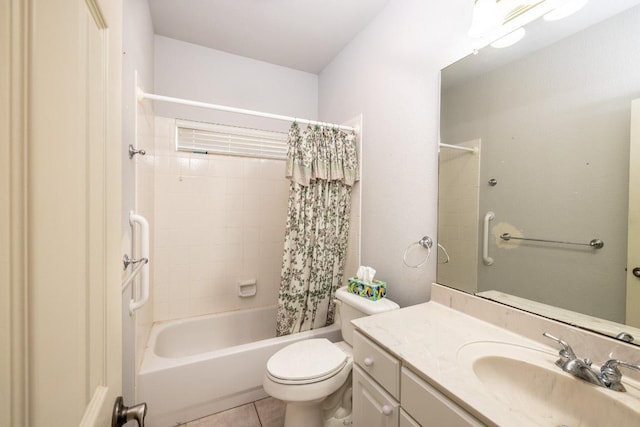 bathroom featuring toilet, vanity, shower / bath combo with shower curtain, and tile patterned floors