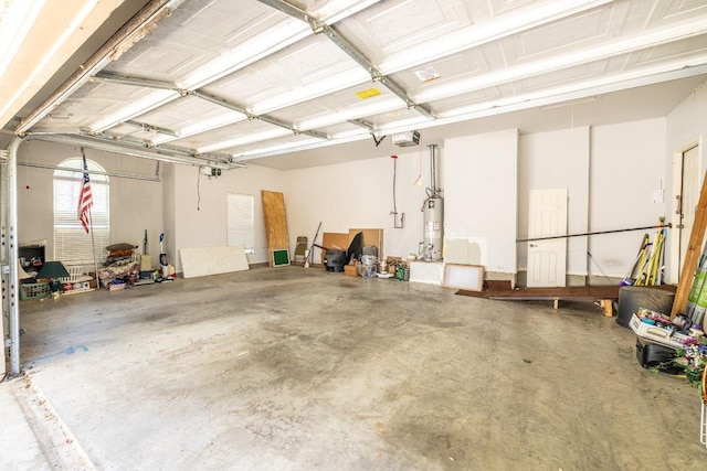 garage featuring water heater and a garage door opener