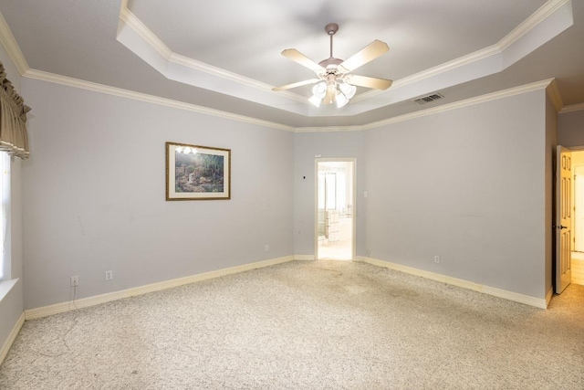 unfurnished room with light colored carpet, a raised ceiling, visible vents, and baseboards