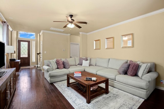 living room with visible vents, baseboards, dark wood-style floors, ceiling fan, and crown molding