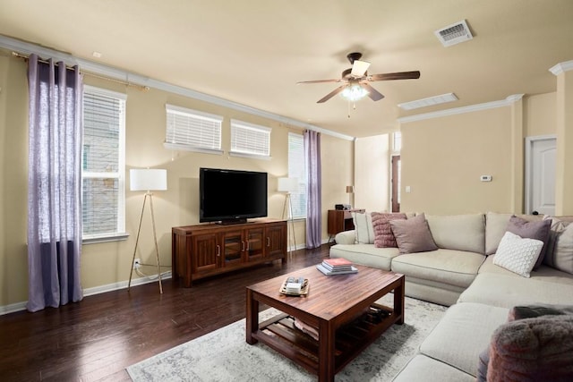 living room with a ceiling fan, baseboards, visible vents, dark wood-style floors, and crown molding