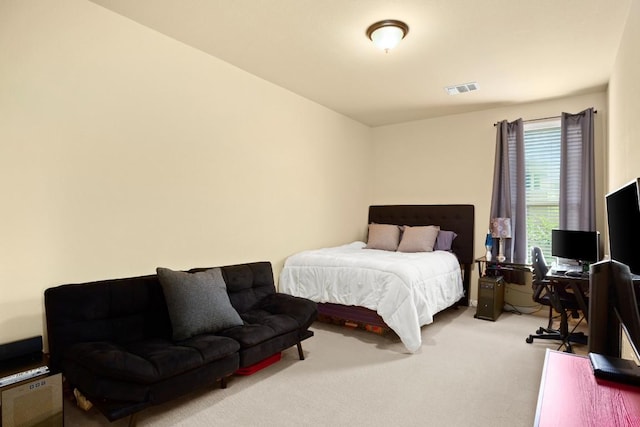 bedroom featuring carpet floors and visible vents