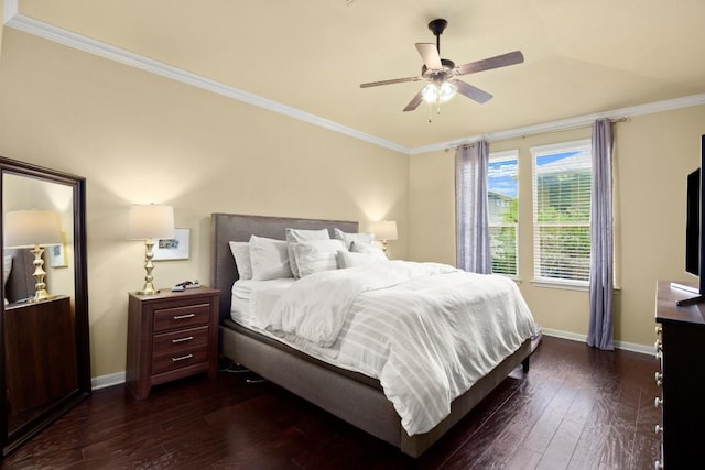 bedroom featuring baseboards, ornamental molding, ceiling fan, and dark wood-type flooring