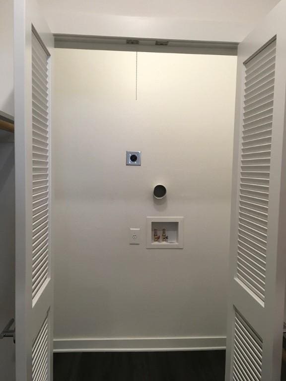 4361 S Congress Ave Unit 304, Austin, TX 78745 - laundry room with electric dryer hookup, hookup for a washing machine, and wood finished floors