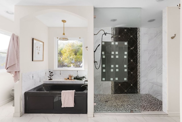 full bathroom featuring a bath, marble finish floor, toilet, and a walk in shower