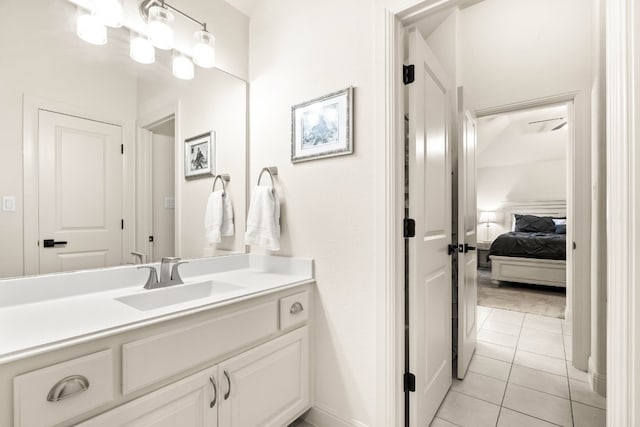 bathroom featuring tile patterned flooring, vanity, and ensuite bathroom