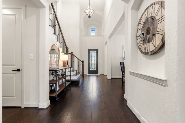 3804 Venezia Vw, Leander, TX 78641 - foyer featuring stairs, a chandelier, dark wood-style floors, and a high ceiling