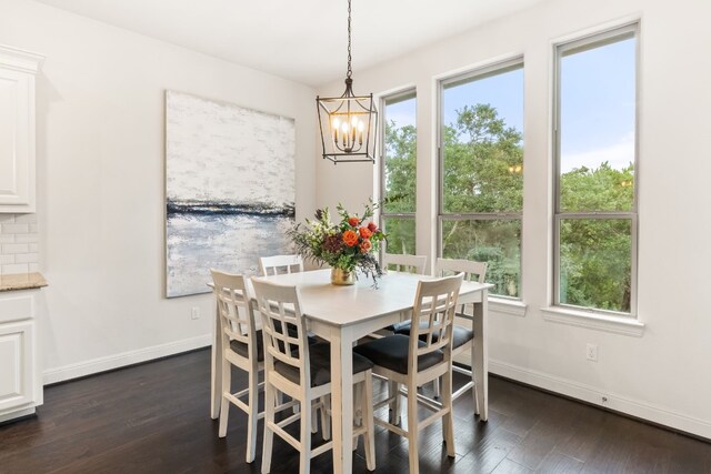 3804 Venezia Vw, Leander, TX 78641 - dining room featuring plenty of natural light, dark wood-type flooring, and a chandelier