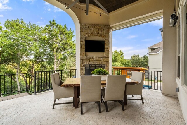 3804 Venezia Vw, Leander, TX 78641 - view of patio with outdoor dining area, an outdoor stone fireplace, and a ceiling fan