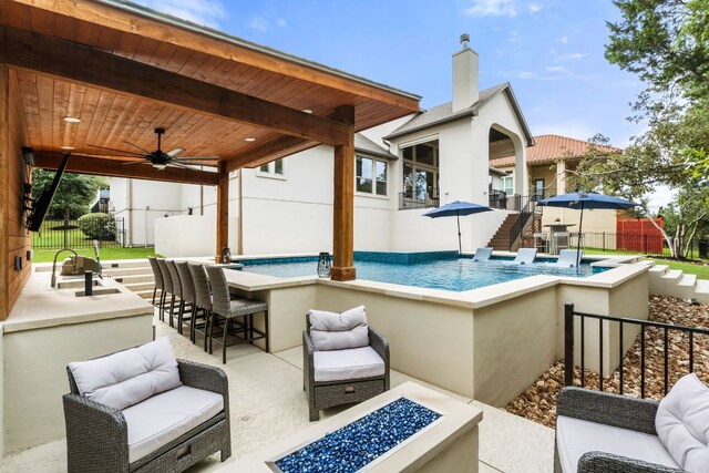 3804 Venezia Vw, Leander, TX 78641 - view of swimming pool featuring an outdoor living space with a fire pit, ceiling fan, and a patio area