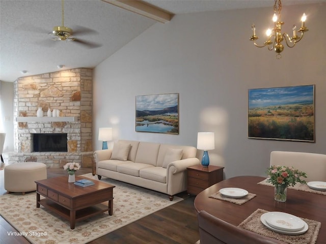 living area featuring vaulted ceiling with beams, a fireplace, wood finished floors, and ceiling fan with notable chandelier