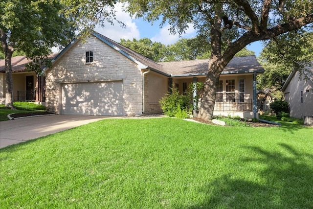 ranch-style home featuring stucco siding, concrete driveway, an attached garage, a front yard, and stone siding