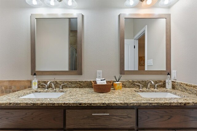 bathroom with double vanity and a sink