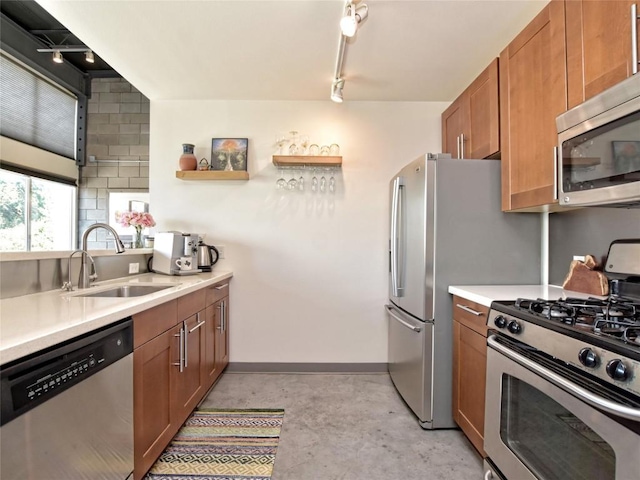 4801 S Congress Ave Unit L4, Austin, TX 78745 - kitchen featuring stainless steel appliances, brown cabinetry, light countertops, concrete flooring, and open shelves