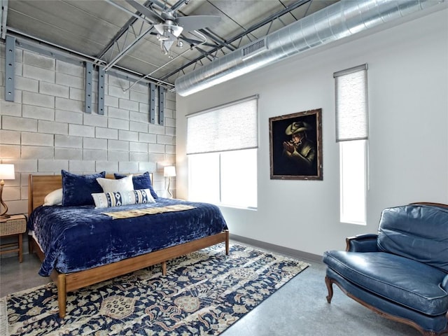 4801 S Congress Ave Unit L4, Austin, TX 78745 - bedroom with finished concrete flooring and baseboards